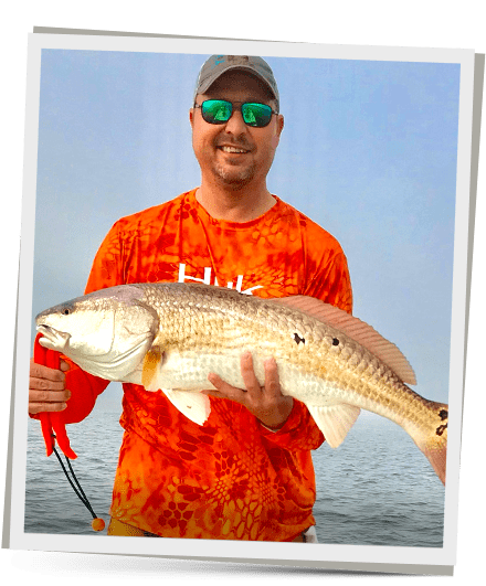 Captin WIth a Redfish he caught