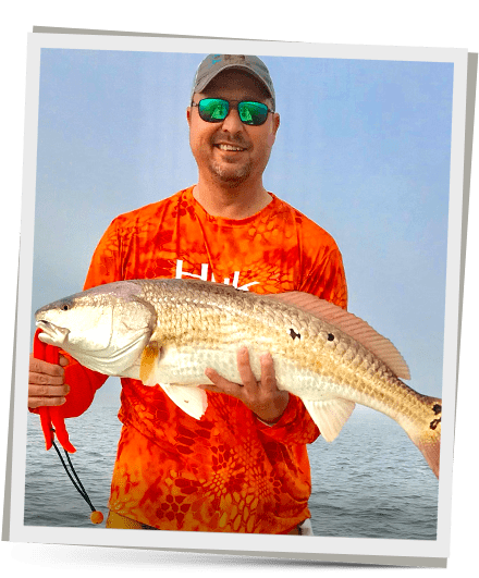 about-image03 Captin WIth a Redfish he caught