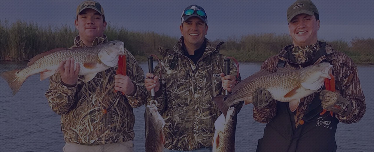 Three men, after a successful fishing excursion