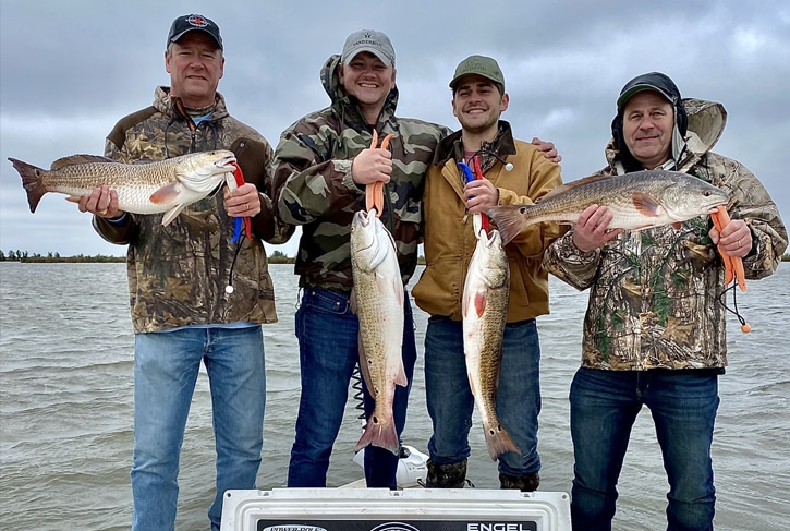 Men After fishing charter in Delacroix with Saltwater Red Drum