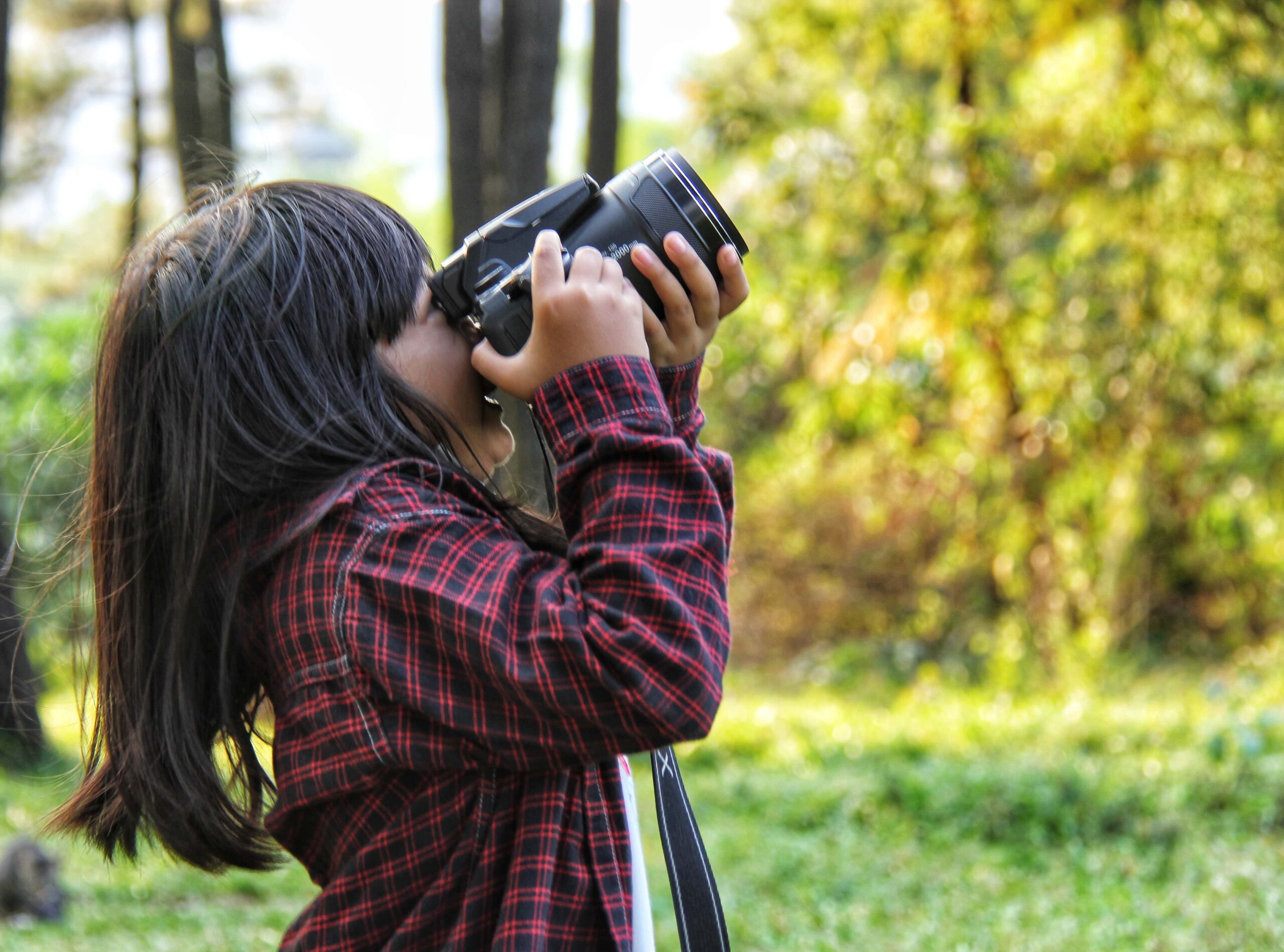 Girl Taking A photo of the woods