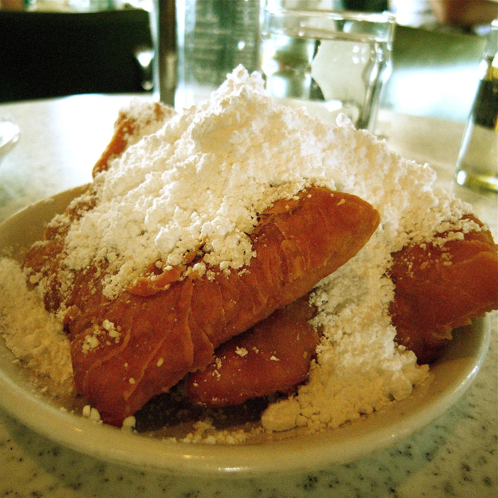 Beignets Covered in Powdered Sugar at Café du Monde