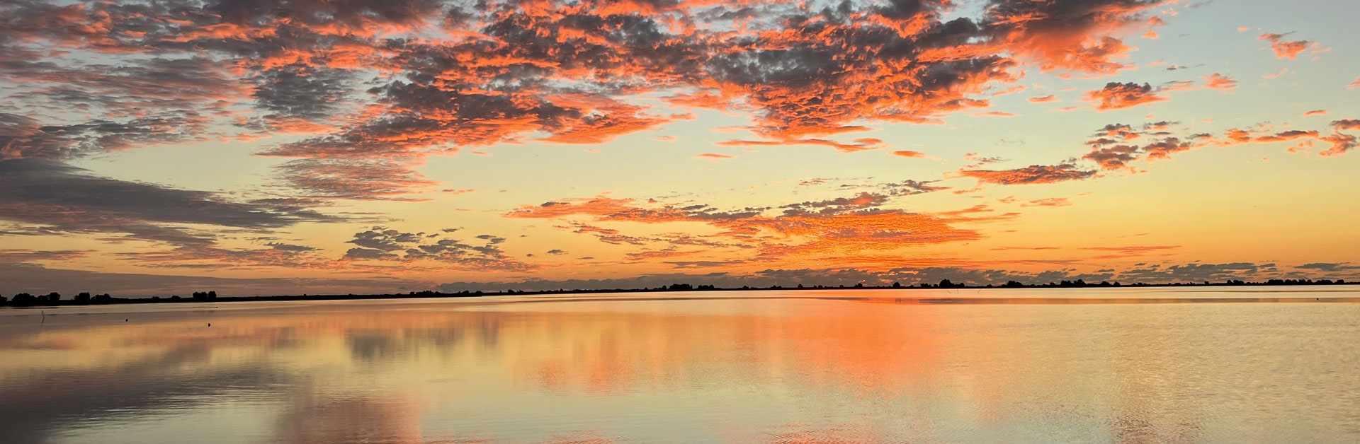 Sunrise over the waters in Delacroix, LA. Perfect day for fly fishing with Whiskey Bayou Charters.