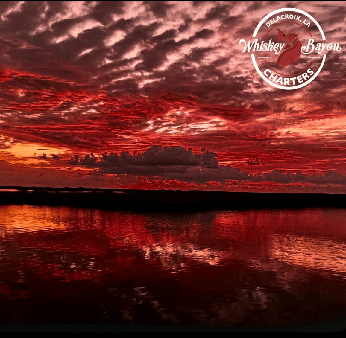 Redskies altered image Moody red sky reflected by the waters of the marsh