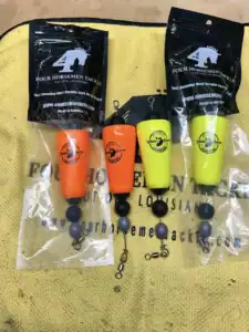 Picture of four horsemen tackles in orange and yellow.