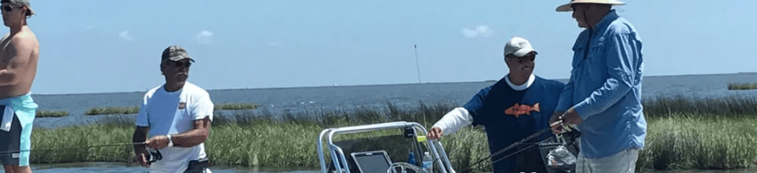 Captain Joe and his crew aboard his boat, talking and laughing.